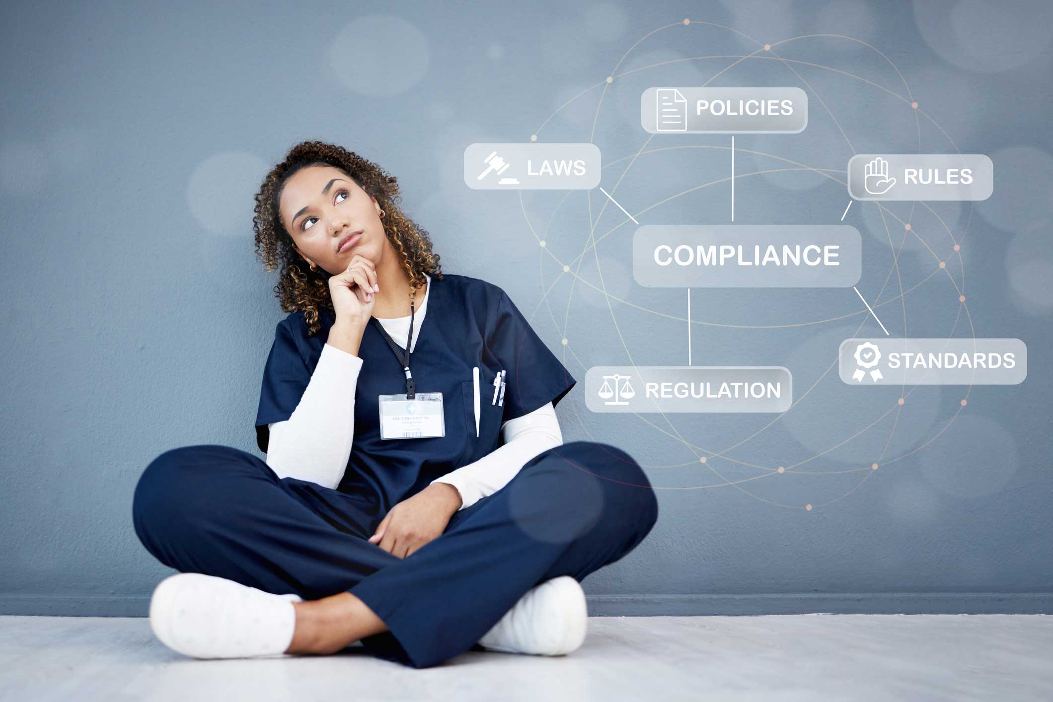 Healthcare professional thinking about compliance, policies, laws, and regulations